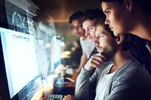 developers around a monitor