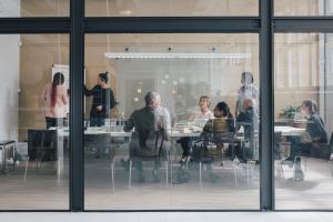 Business team in glass conference room