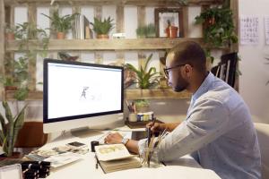 Person at desk working on computer in office