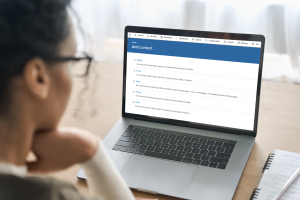 Color image of brunette woman looking at laptop screen that reads "Add content"