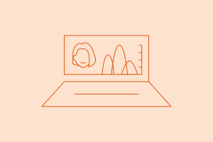 Laptop with person's head next to chart