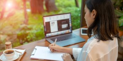woman at laptop writing