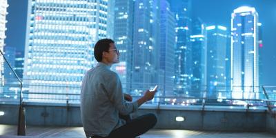 man sitting on roof at night
