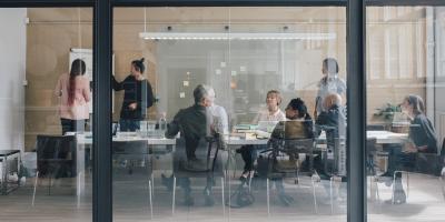 Business team in glass conference room