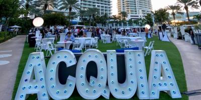 Color photo of outdoor Acquia signage at Engage Miami