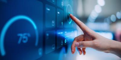 Hand pointing to data presentation on computer screen