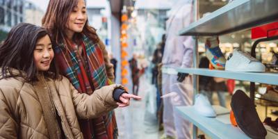 Woman and child looking at store window