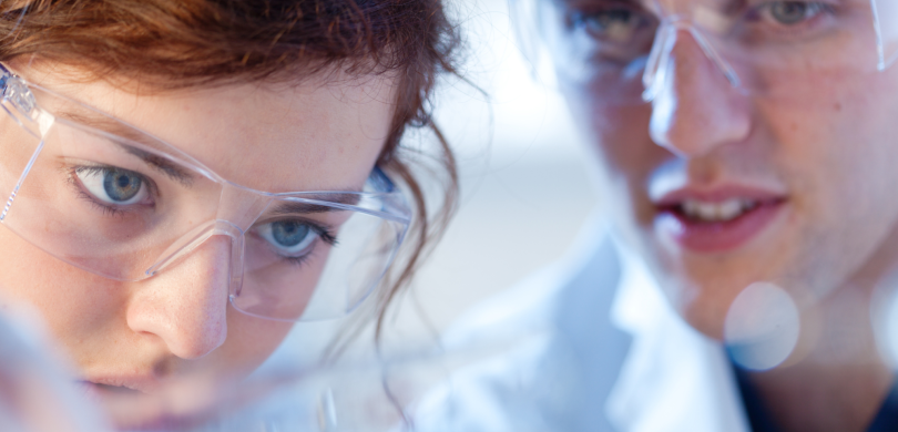 Scientists wearing goggles