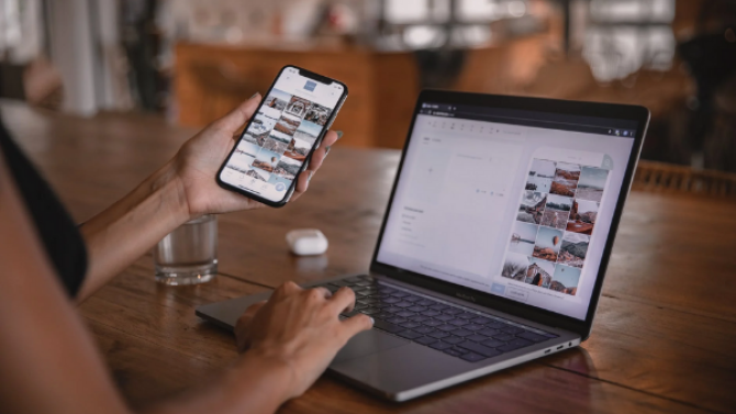 Person looking at laptop and mobile