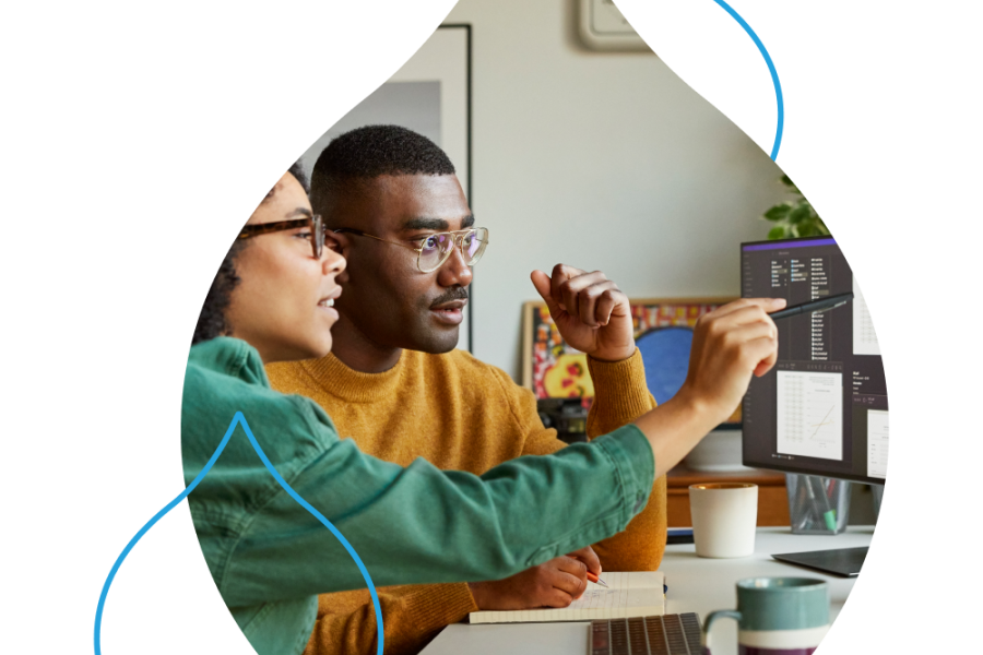 Two people looking at a computer