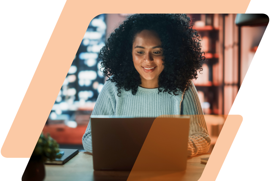 Image of a girl on a laptop masked in a parallelogram with orange parallelograms surrounding the image