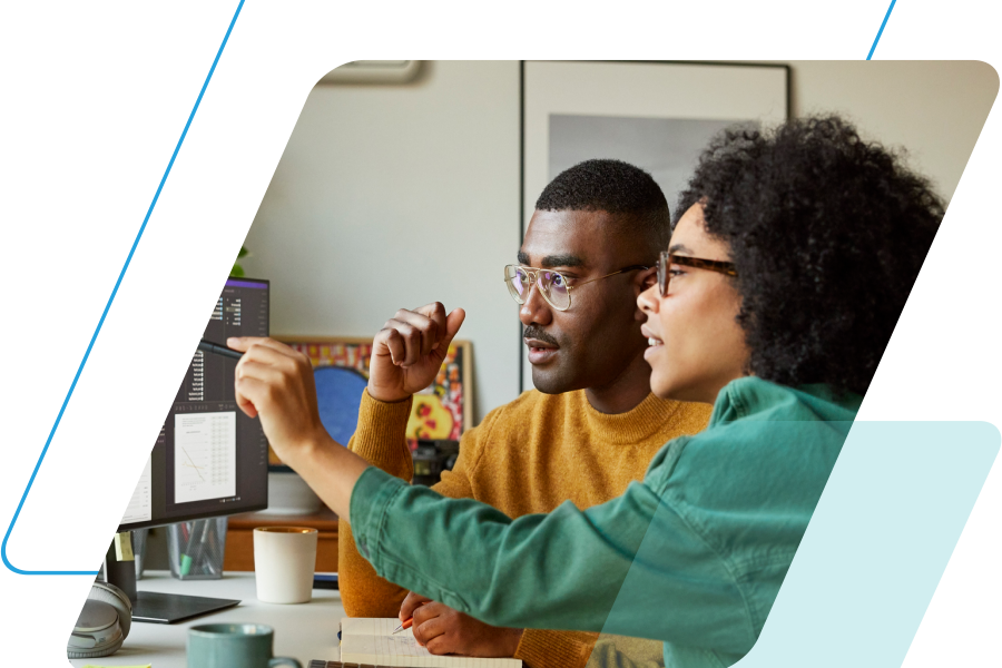 blue and teal parallelograms with an image of two people looking at a desktop