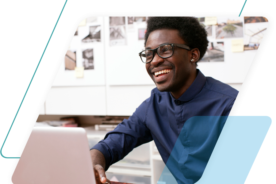 teal and blue parallelograms with an image of a man on a laptop cropped by a parallelogram