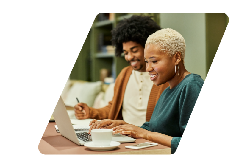 Two people looking at a computer