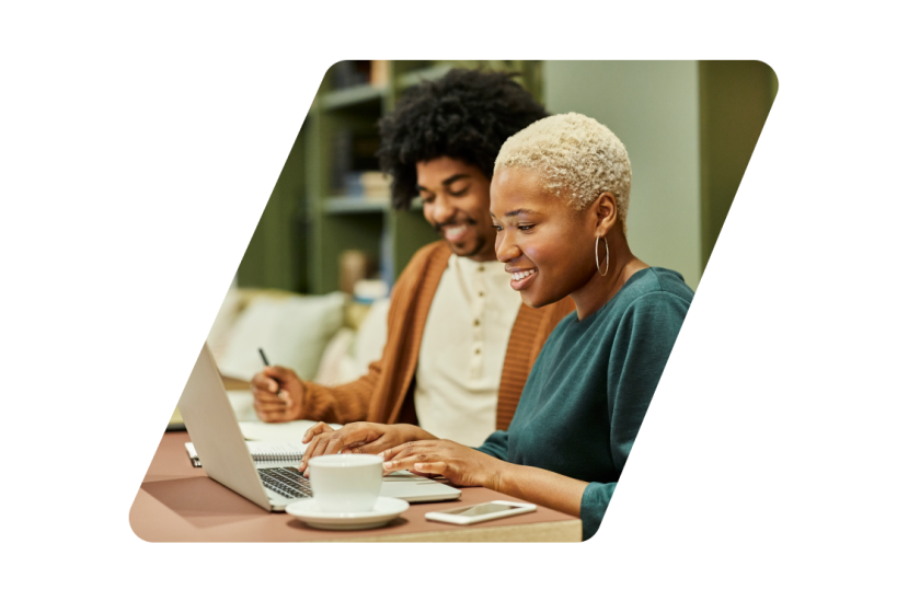 Two people looking at a computer