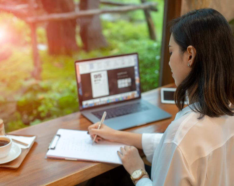 woman at laptop writing