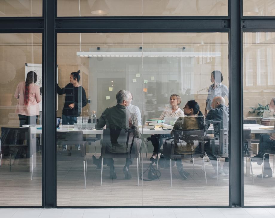 Business team in glass conference room