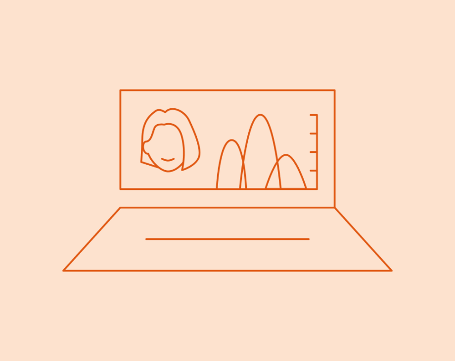 Laptop with person's head next to chart