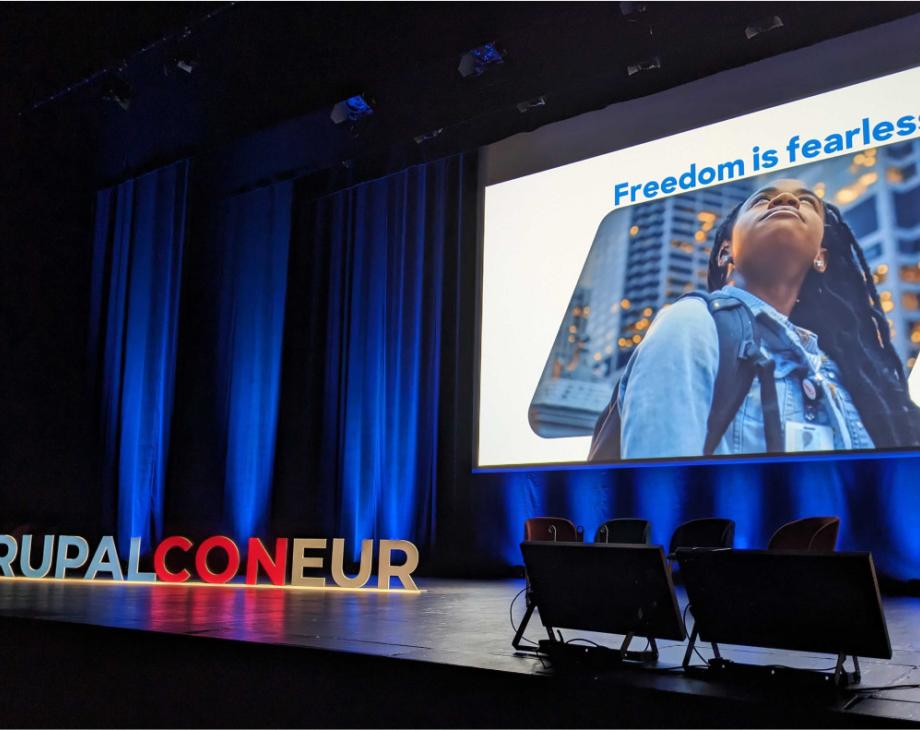 Color photo of empty stage at DrupalCon Lille