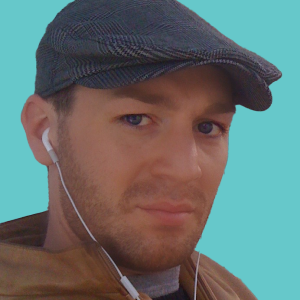 Headshot of Rob with Teal background
