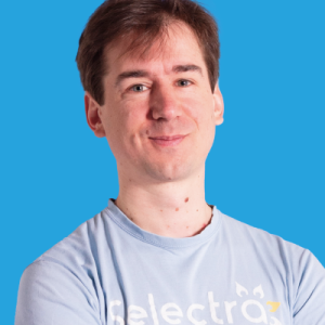 Aurian de Maupeou Headshot with blue background