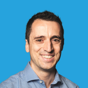 Sebastien Delorme Headshot, Blue Background