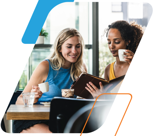 blue and orange parallelograms with image of two women talking over a laptop