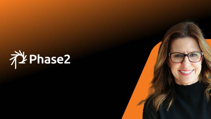 Woman next to the Phase2 logo