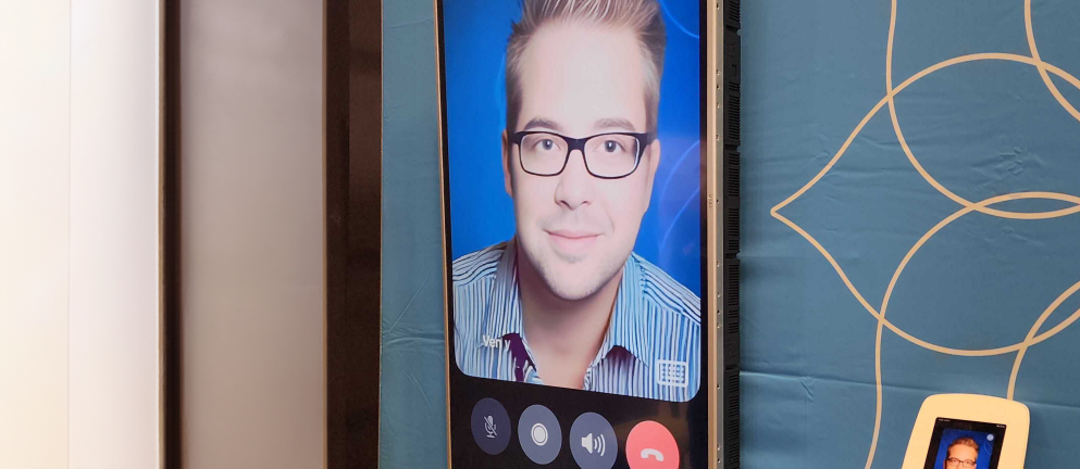 Color photo of ChatDriesPT mobile interface at Acquia booth at DrupalCon Lille 2023