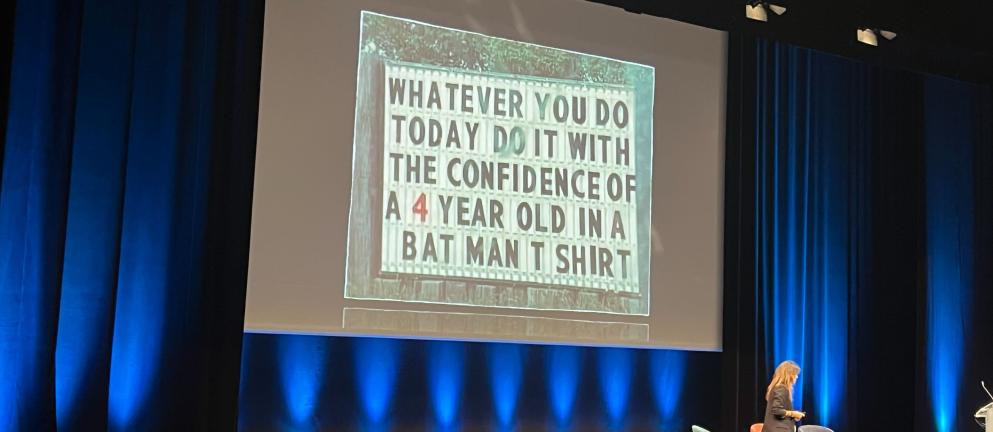 Color photo of Sarah Furness on stage at DrupalCon Lille
