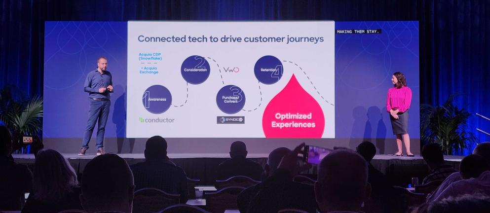 Color photo of Deanna and Ballew on stage at Engage Boston 2023